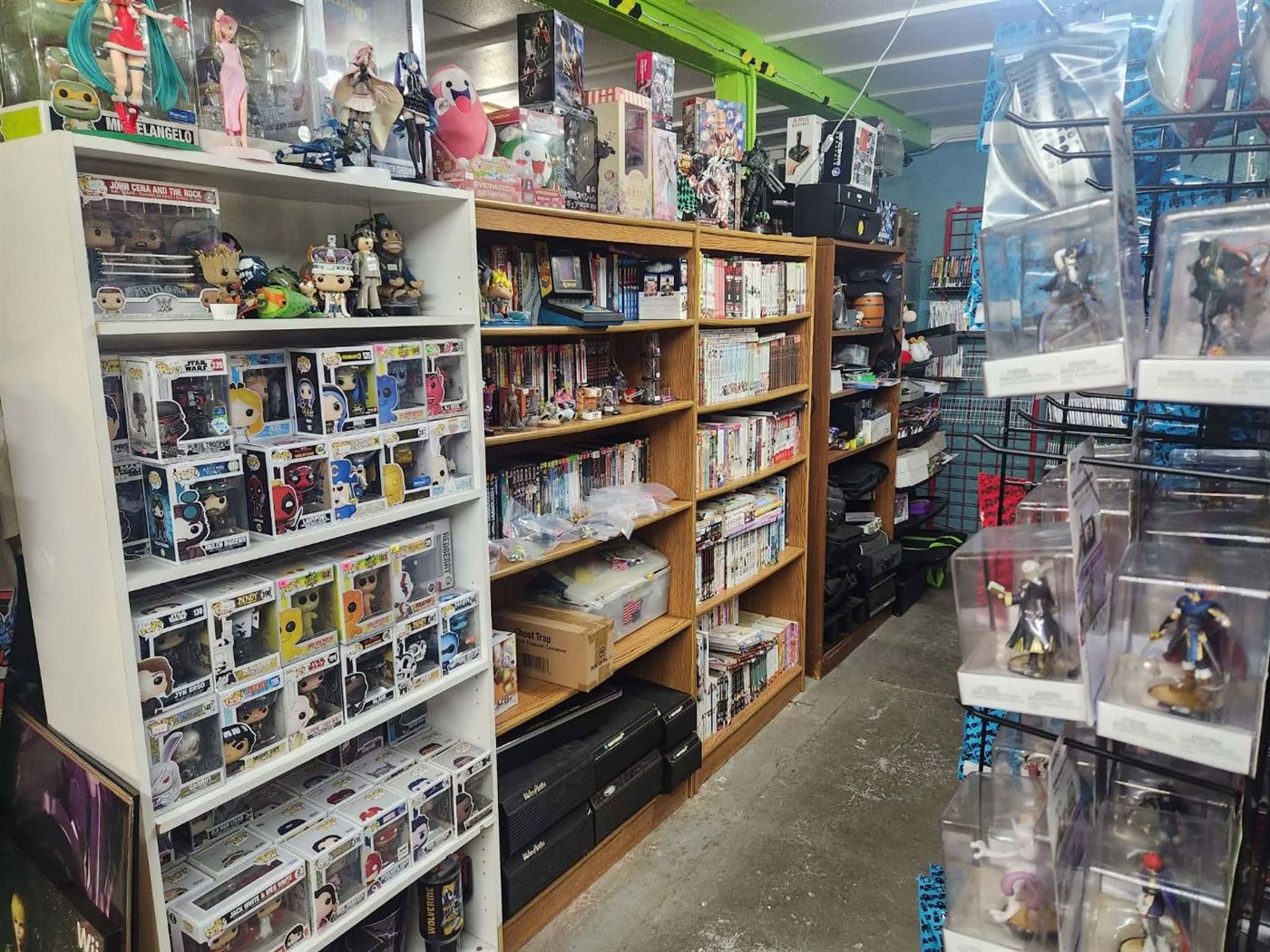 Funko Pops, figures and manga shelves